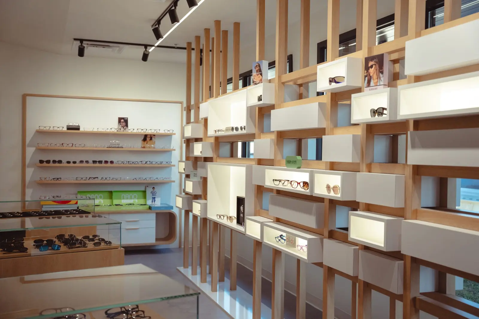 The Claye optical with slatted oak shelving and track lights